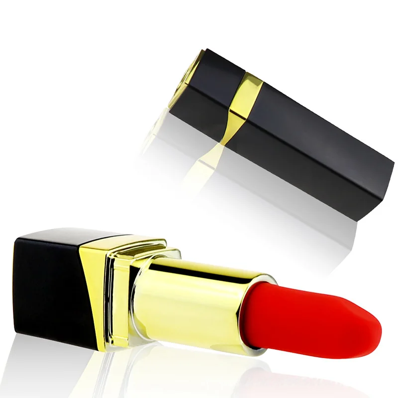Black and gold lipstick-shaped personal massager and cap with reflection