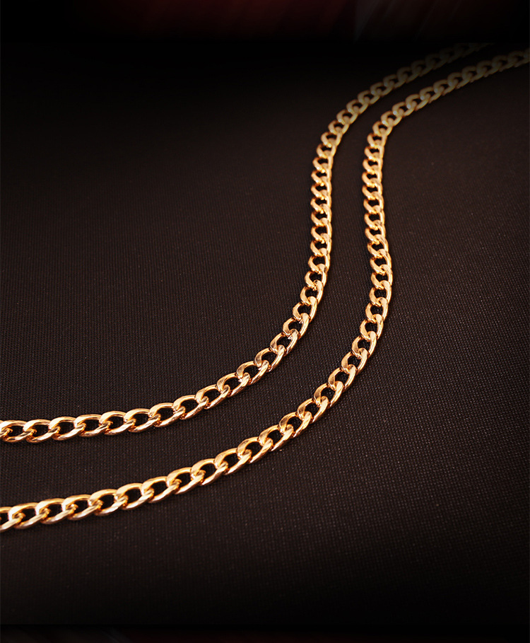Gold-tone chain detail and English supplier reference
