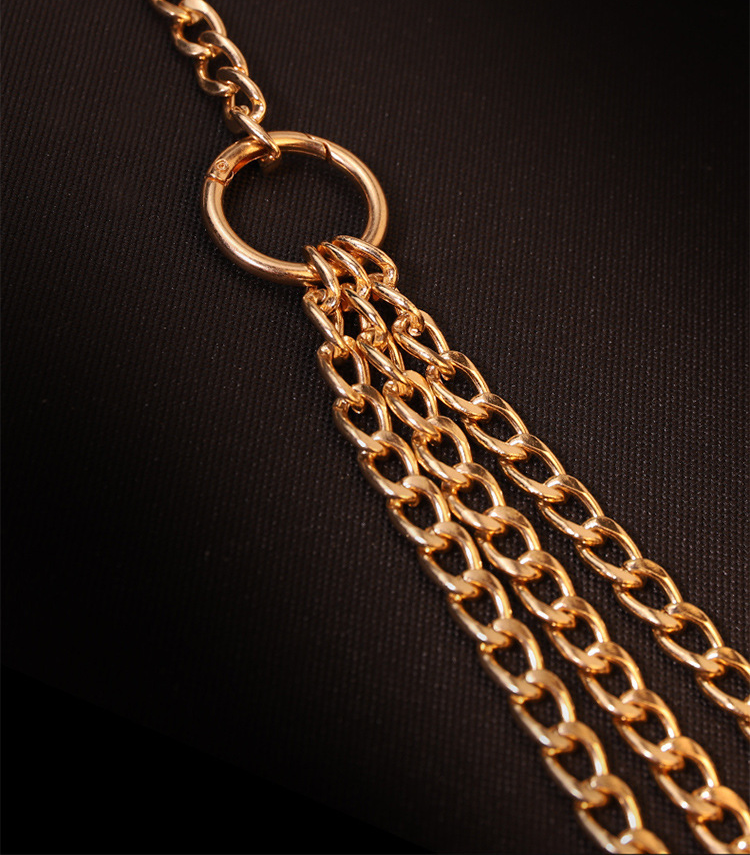Gold-tone chain detail and English supplier reference