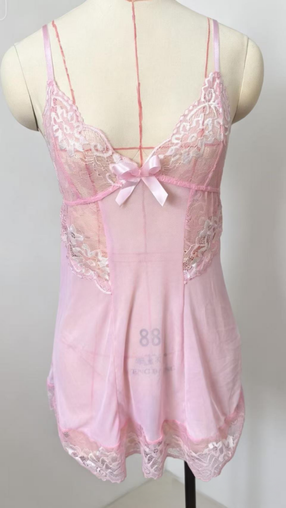 Pale pink lace nightdress on a dressmaking mannequin